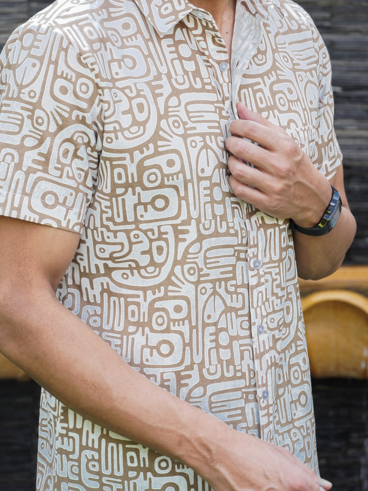 Close-up of brown and cream Urban Tribal pattern on beige cotton shirt