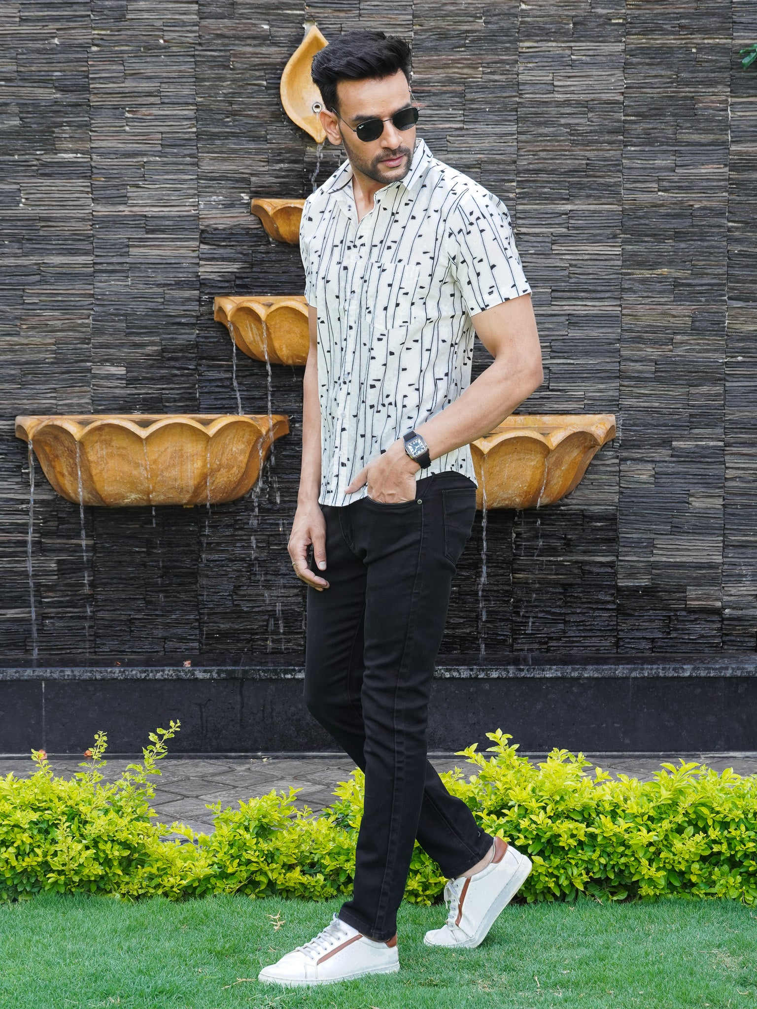 Model wearing men’s white black abstract striped cotton shirt