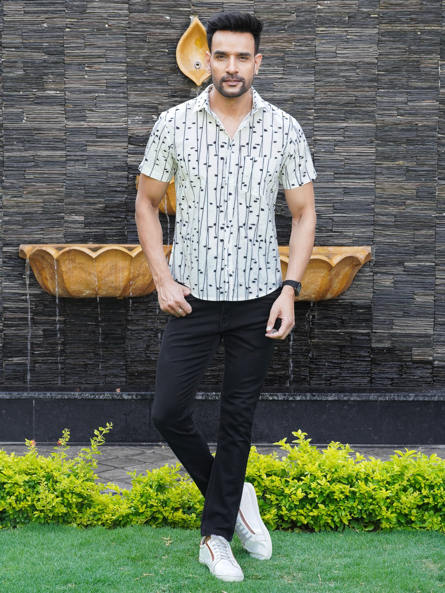 Model wearing men’s white black abstract striped cotton shirt