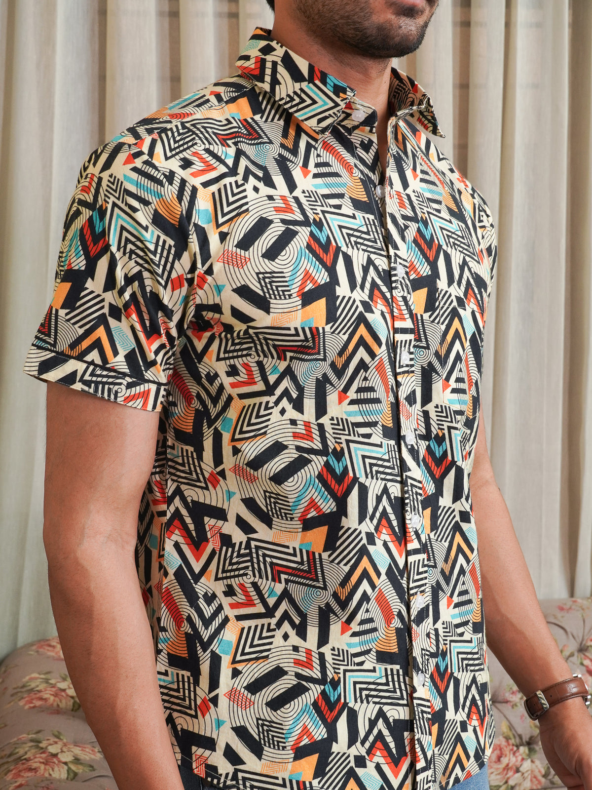 Close-up of black rust teal and cream geometric motifs