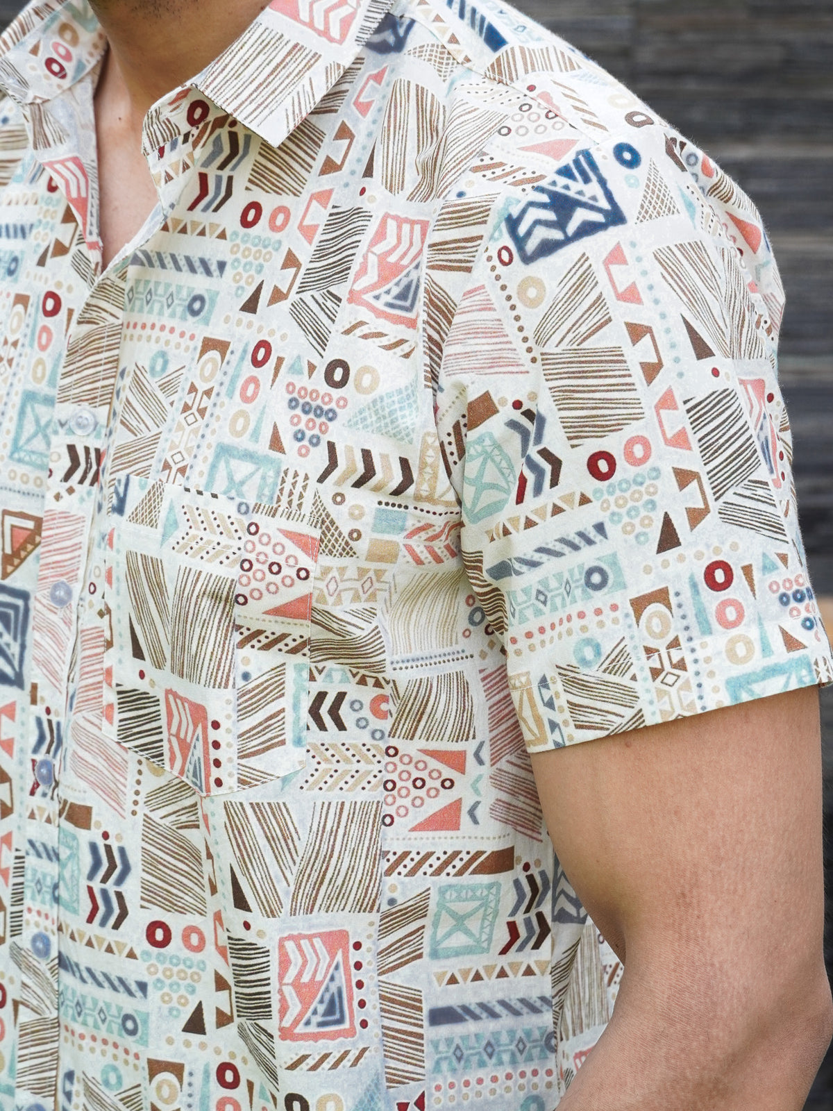 Close-up of rust teal blue and beige geometric motifs