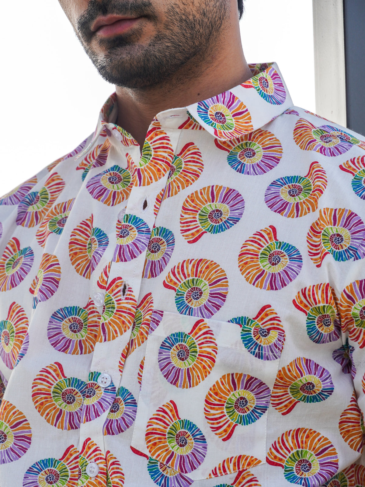Close-up of orange purple green and blue spiral motifs