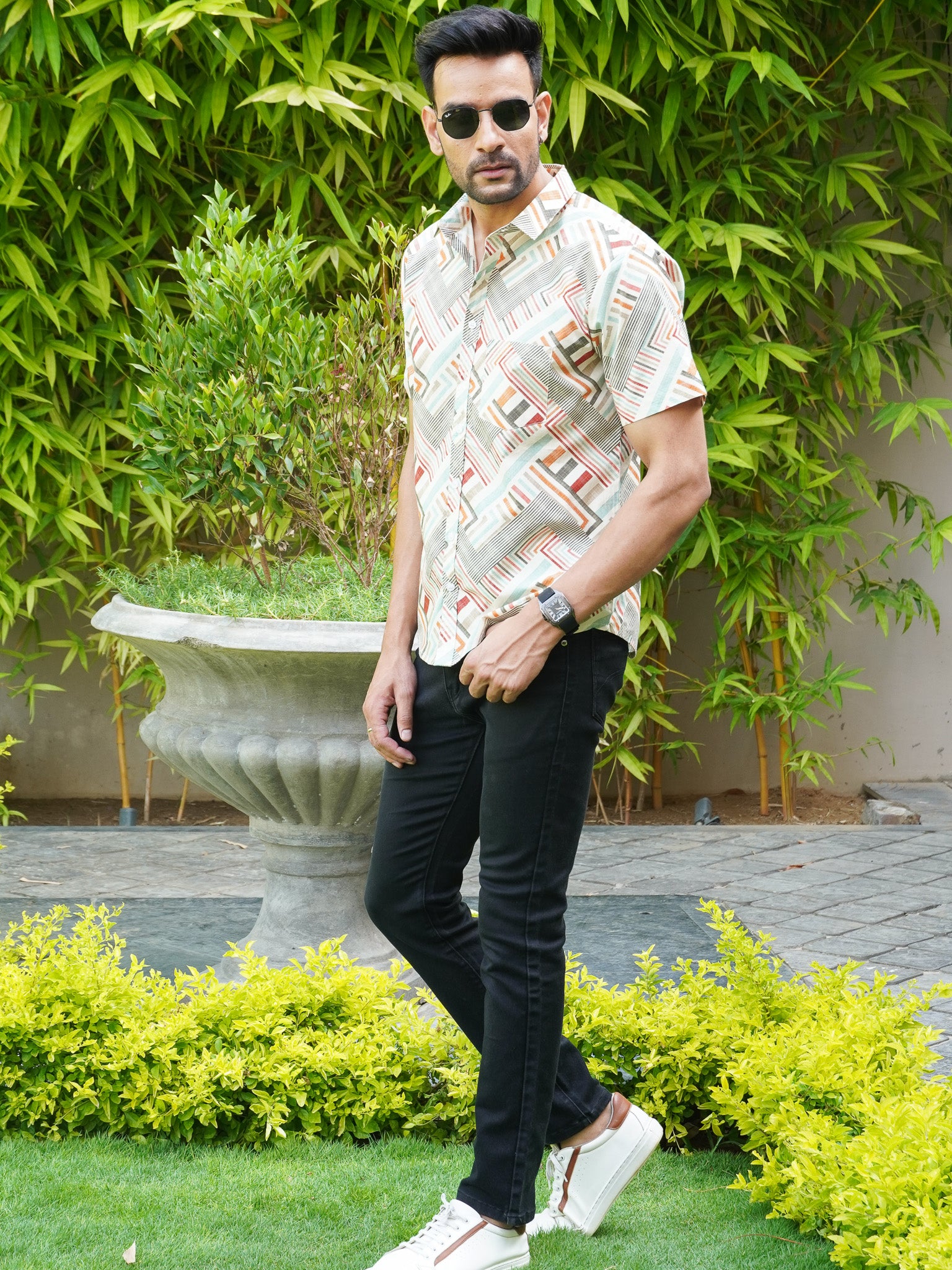 Side view of multicolour geometric stripe half sleeve shirt for men