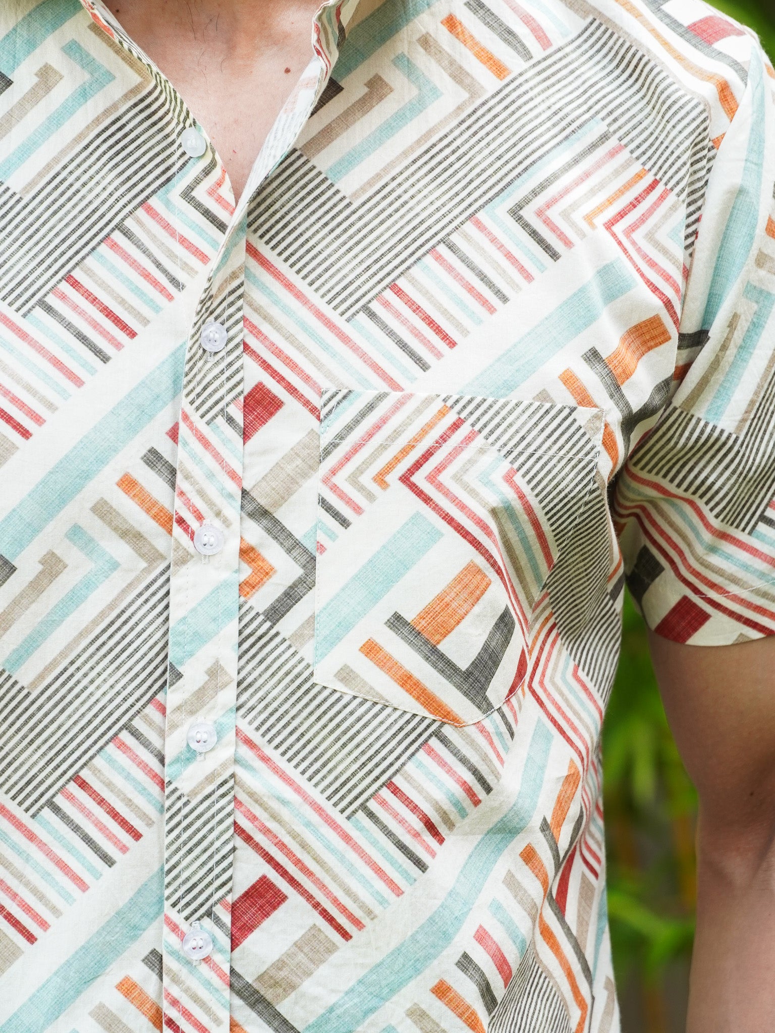 Close-up of multicolour abstract geometric stripe print on cotton shirt
