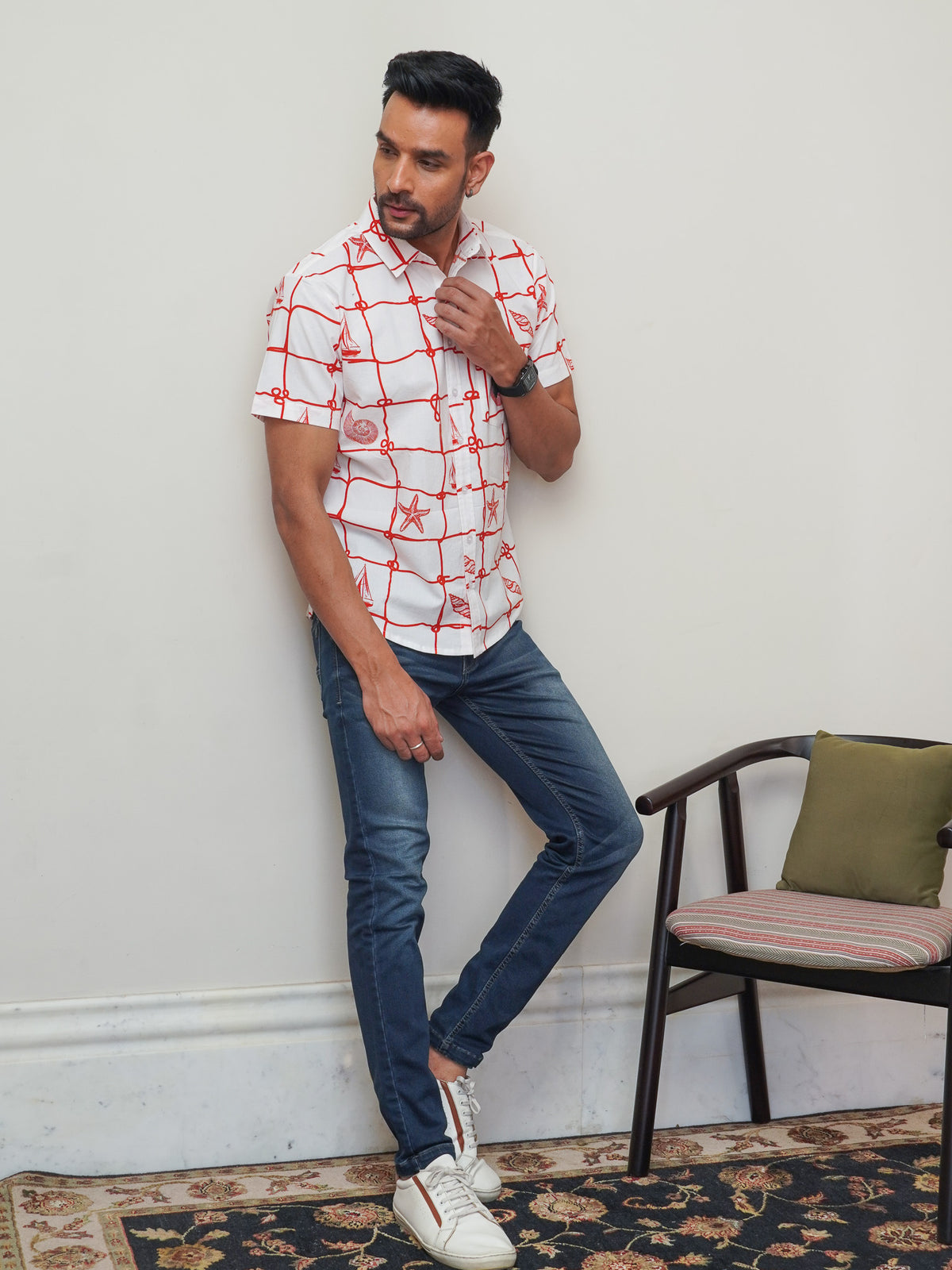 Model wearing men’s white red nautical print half sleeve shirt