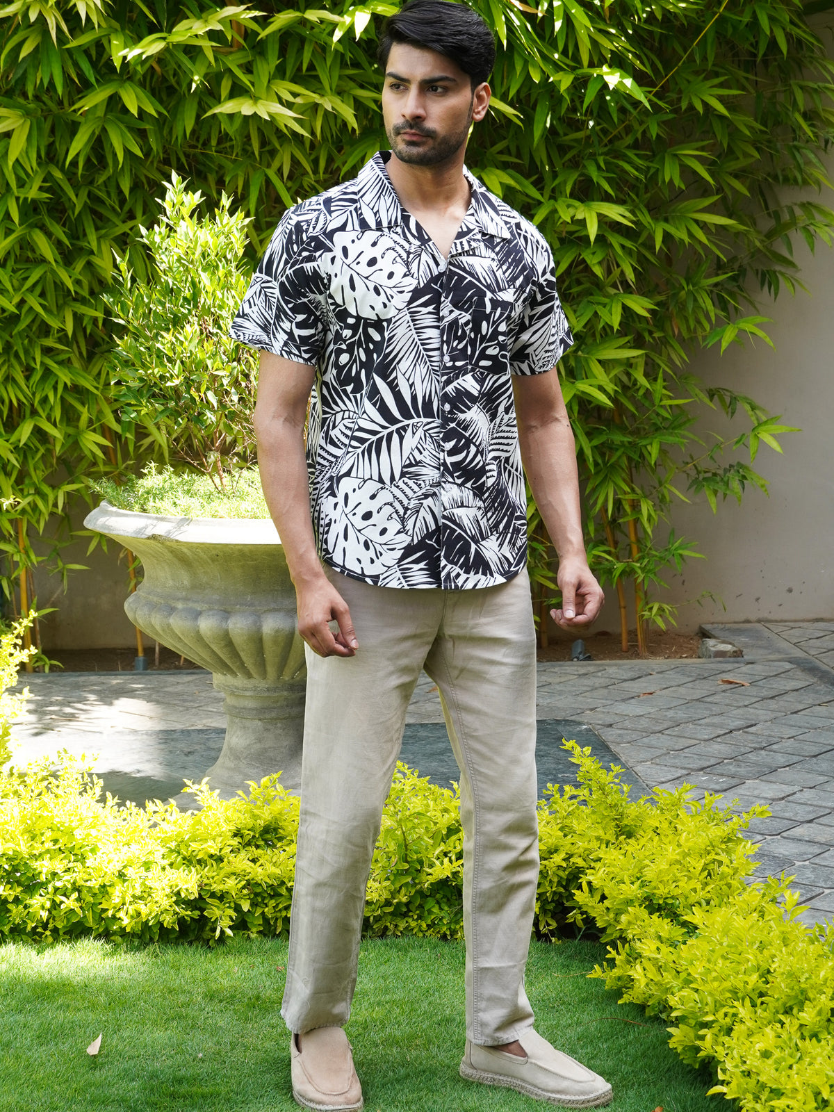 Relaxed collar detail on men’s black and white tropical printed shirt