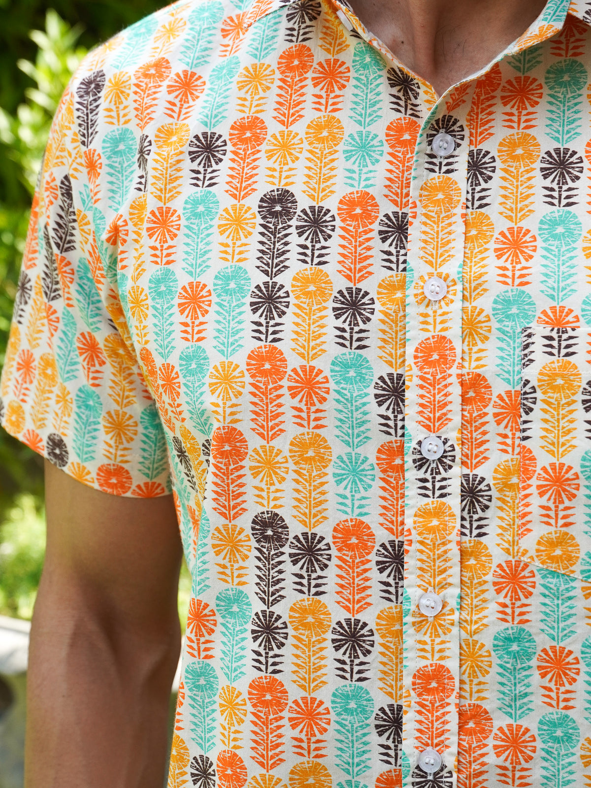 Close-up of orange teal mustard and black retro motifs