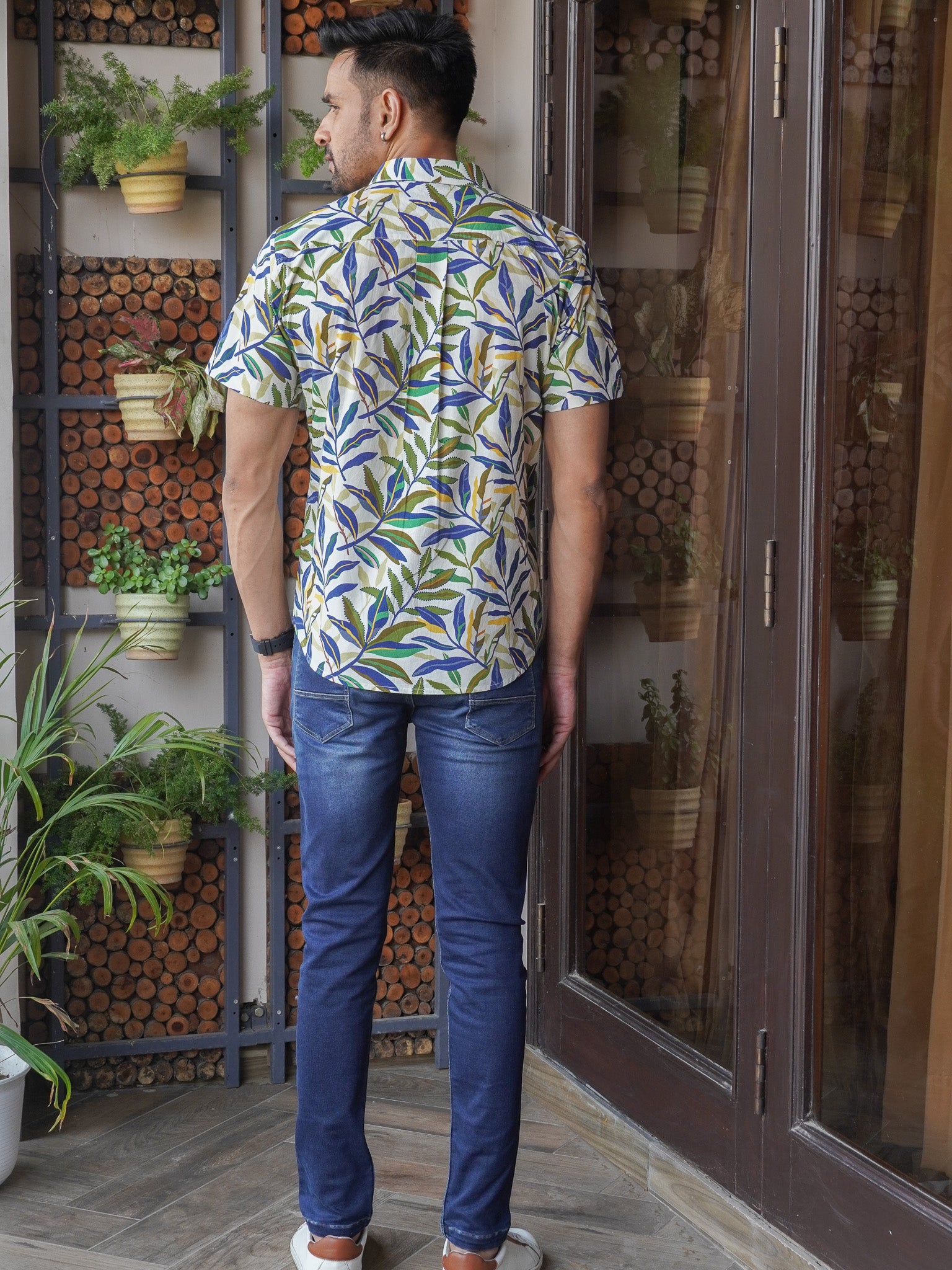 Back view of men’s white tropical leaf print regular fit shirt