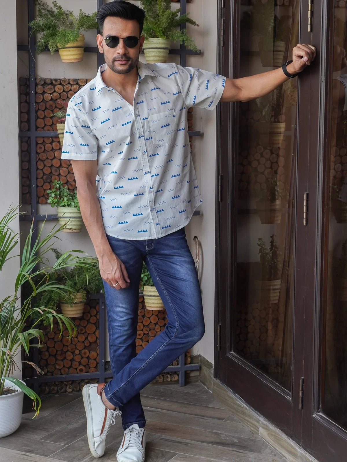 Front view of men’s white and blue abstract printed cotton shirt