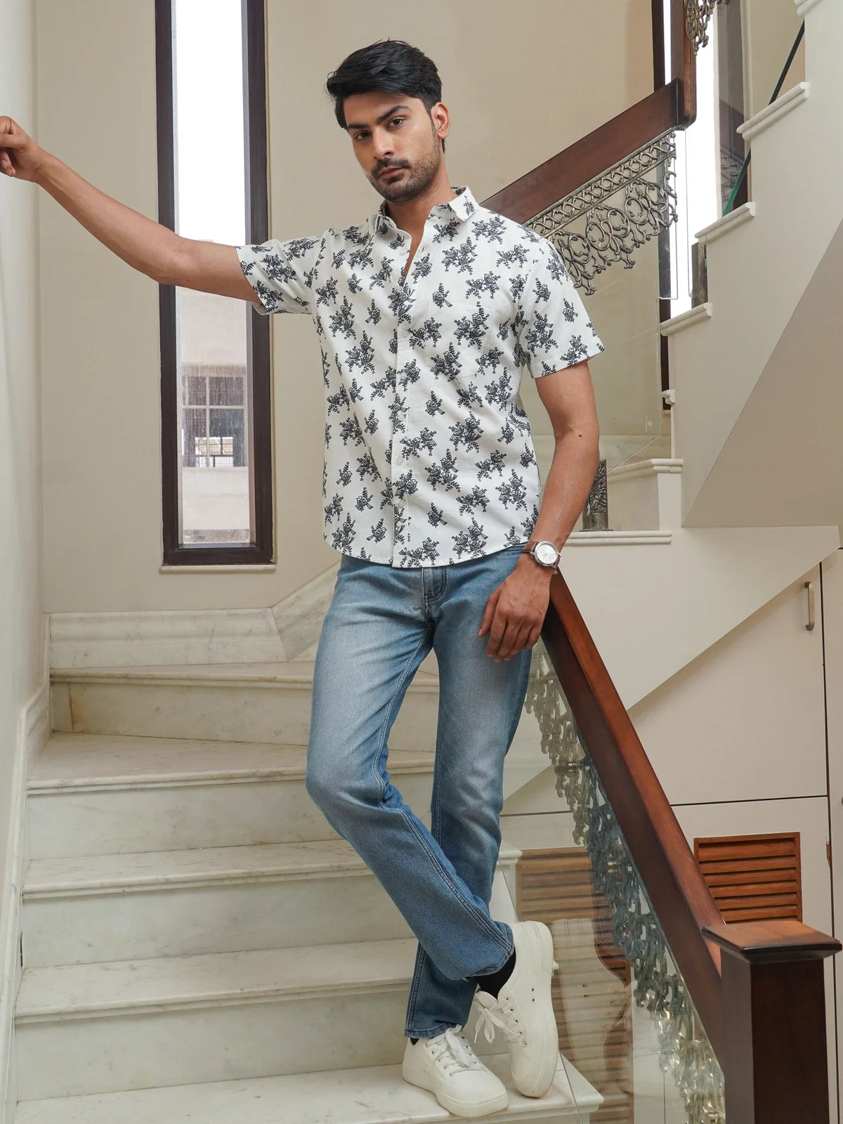 Button-front detail on men’s white printed cotton shirt