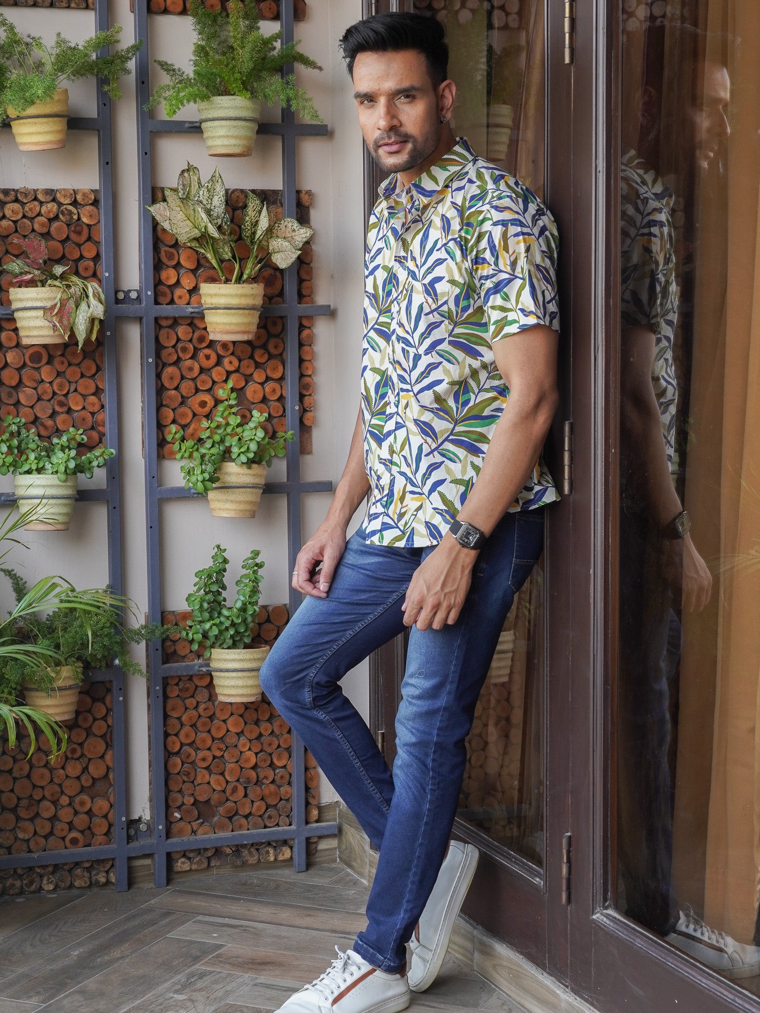 Side view of white tropical leaf print half sleeve shirt for men