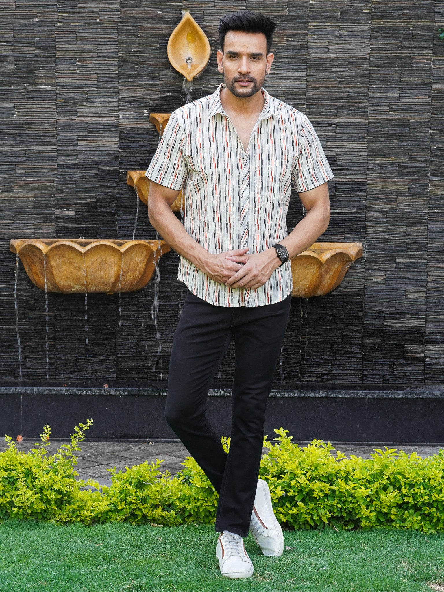 Model wearing men’s multicolour checked stripe cotton half sleeve shirt